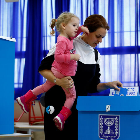 A woman casts her ballot as she votes in Israel's national election at a polling station in Tel Aviv, Israel March 2, 2020. REUTERS/Corinna Kern - RC2MBF9DATS2