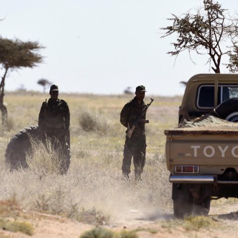 Members of the Polisario Front stand guard during a visit of the United Nations chief on March 5, 2016, in Bir-Lahlou, in the disputed territory of Western Sahara, situated 220 kilometres (137 miles) southwest of the Algerian town of Tindouf.
UN Secretary General Ban Ki-Moon, who met Polisario Front leaders including its Secretary General, said he would "spare no effort" in trying to find a solution to the Western Sahara issue. / AFP / Farouk Batiche        (Photo credit should read FAROUK BATICHE/AFP via G