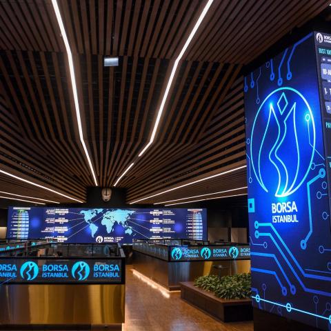 Grapfics and numbers of trade markets are screened on the floor of the Borsa Istanbul on May 22, 2018 in Istanbul. - Turkey's embattled currency, the Lira, on May 22 hit new historic lows against the US dollar after Fitch ratings agency expressed concerns over the central bank's independence in the wake of comments by President Recep Tayyip Erdogan. (Photo by OZAN KOSE / AFP)        (Photo credit should read OZAN KOSE/AFP via Getty Images)