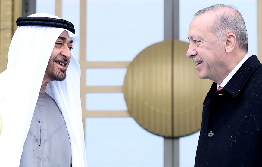 Turkish President Recep Tayyip Erdogan, on the right, welcomes Abu Dhabi's Crown Prince Sheikh Mohammed bin Zayed, during an official ceremony at the Presidential Complex in Ankara, on November 24, 2021