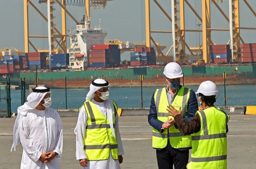 Britain's Prince William, Duke of Cambridge (2nd R), visits the massive Jebel Ali port in the Gulf emirate of Dubai 