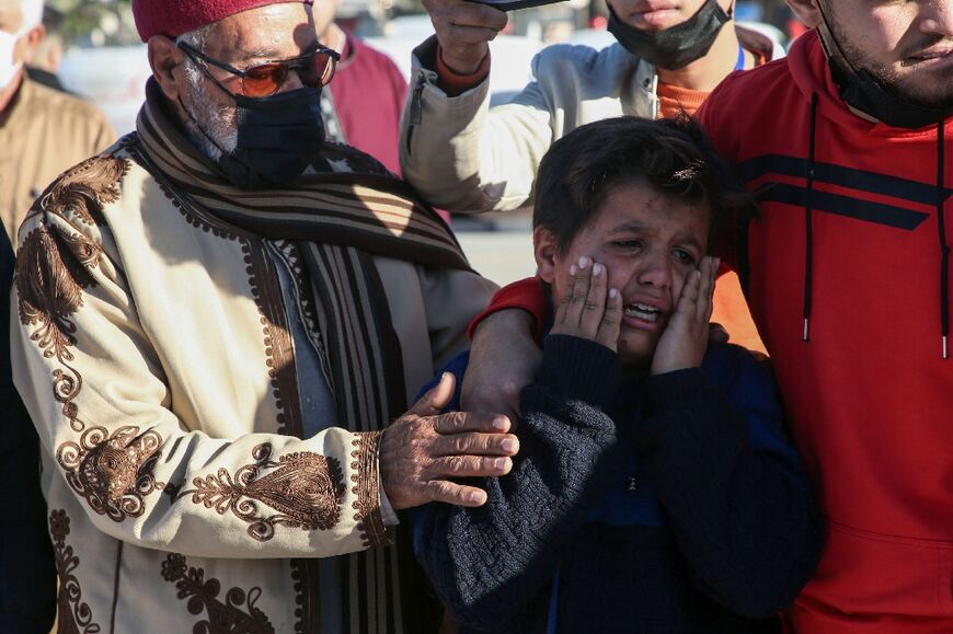 Relatives of Tarhuna victims mourn during a January 22, 2020 prayer ceremony in Martyrs' Square in Tripoli before their burial