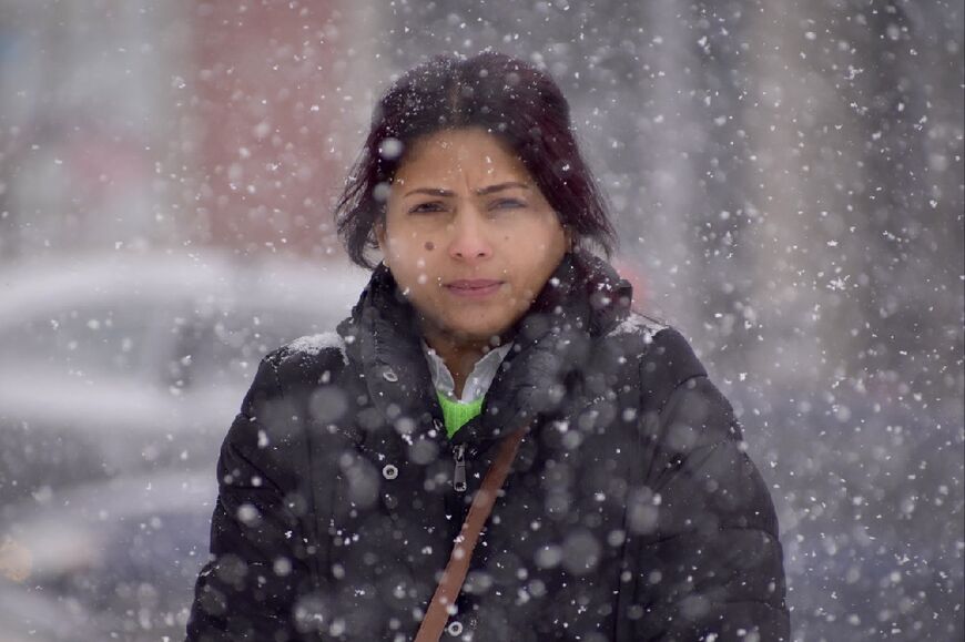 Saudi blogger Raif Badawi's wife, Ensaf Haidar, seen here in February 2022 at a 374th vigil organized for the release of her husband in Sherbrooke, Canada, is so excited about his release that she is "at a loss for words," according to Amnesty International 