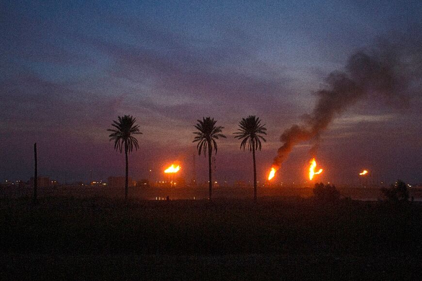 Analysts say the wasted flared gas, such as pictured in the Nahr Bin Omar oil field, is particularly egregious as Iraq is a significant importer of natural gas