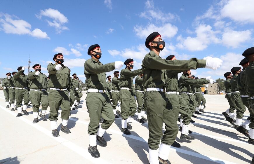 Libyan armed forces troops loyal to the Tripoli-based government at a military graduation parade in Libya's northwestern city of Misrata on March 3, 2022