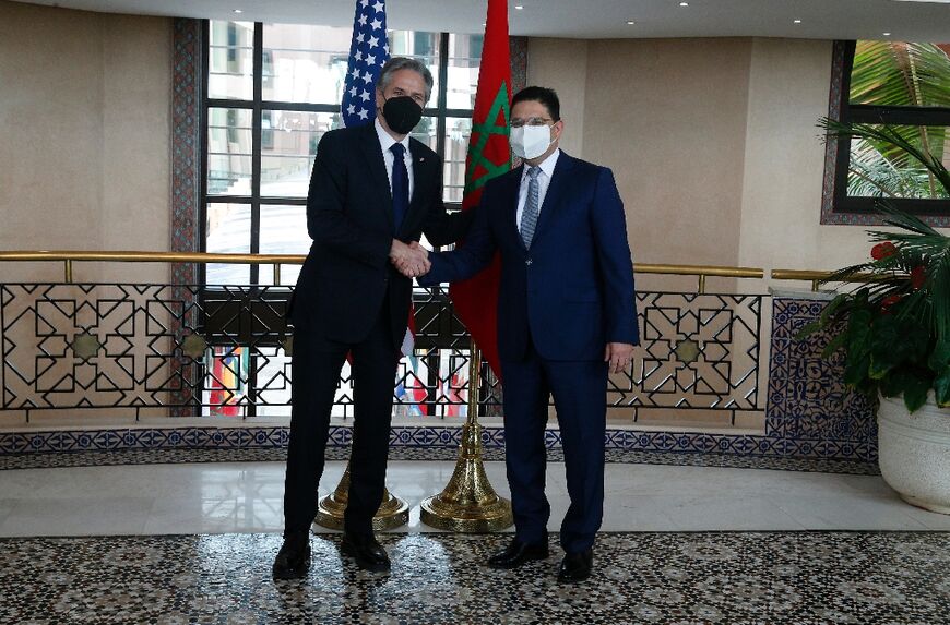 US Secretary of State Antony Blinken (L) shakes hands with Morocco's Foreign Minister Nasser Bourita (R) during their meting in the capital Rabat on Tuesday