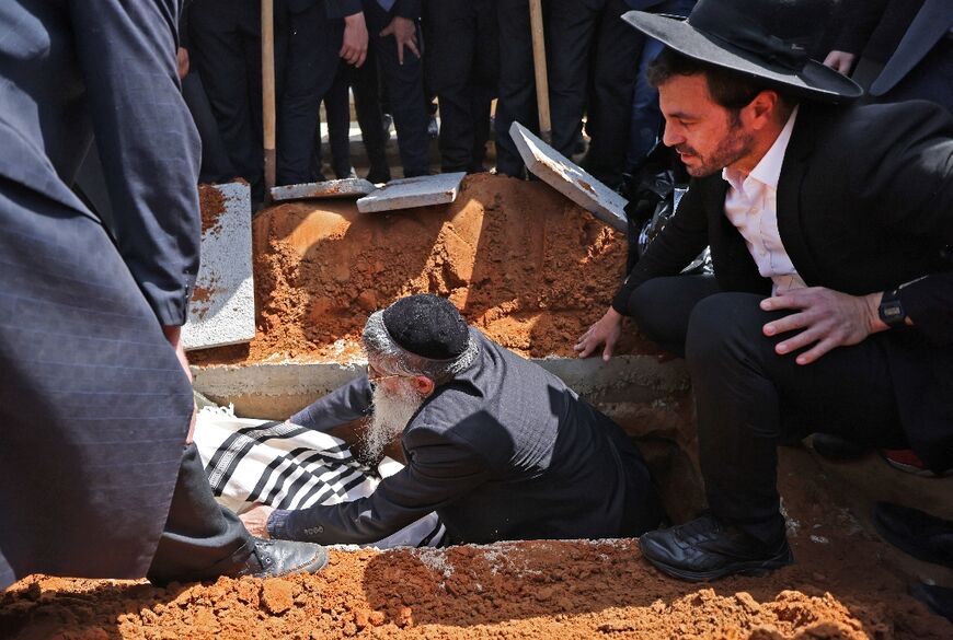 Israeli mourners at the funeral of Avishai Yehezkel, one of the five people killed in the shooting attack in the religious town of Bnei Brak, on March 30, 2022