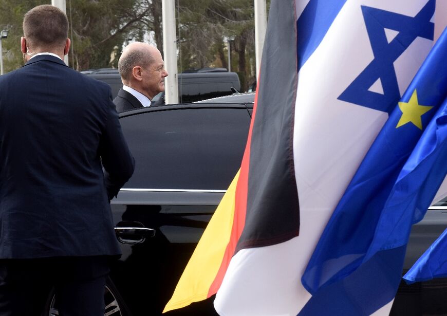 German Chancellor Olaf Scholz enters his car after visiting the Knesset in Jerusalem