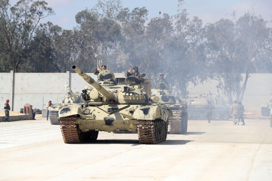 Libyan forces loyal to the Tripoli-based government take part in a military graduation parade in the northwestern city of Misrata on March 3, 2022