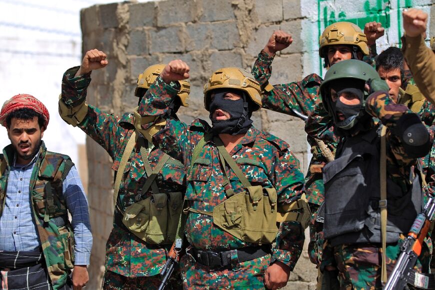 Forces loyal to Yemen's Huthi rebels take part in a military parade marking the seventh anniversary of the Saudi-led coalition's intervention in their country, in the capital Sanaa, on March 31, 2022