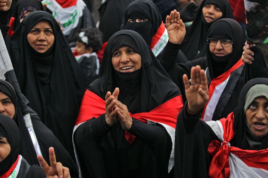 Iraqi women demonstrate in the capital Baghdad on December 13, 2019 amid wider anti-government protests against corruption, poor public services and a lack of jobs