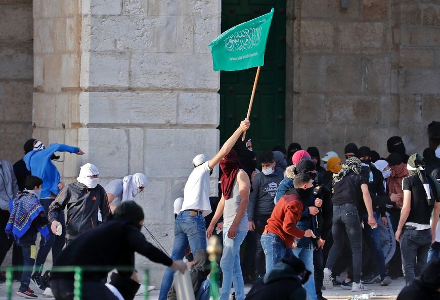 A Palestinian protester waves a flag of Hamas, the Islamist movement that controls the Gaza Strip