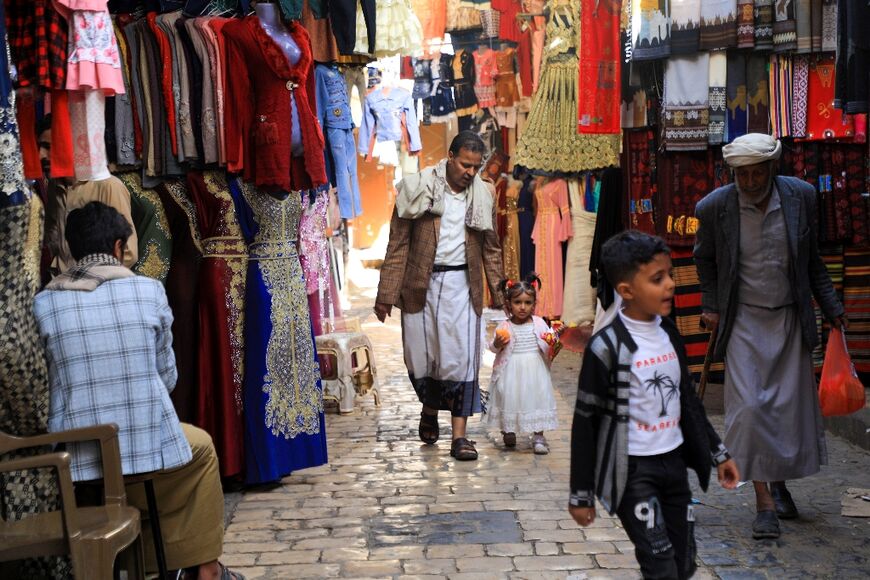 Yemenis shop at a market in the old city of the Yemeni capital Sanaa on the first day of the Muslim holy month of Ramadan, on April 2, 2022