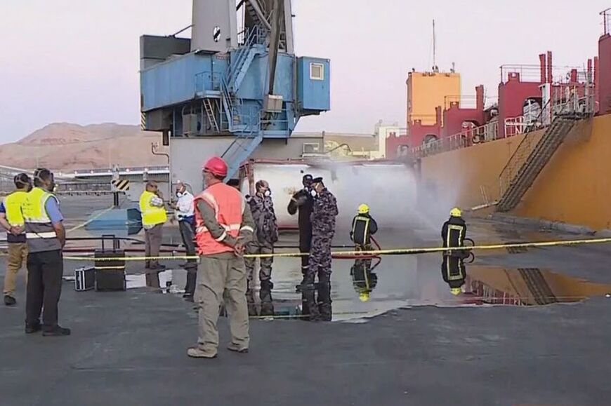 Footage on state TV showed a large cylinder plunging from a crane on a moored vessel in Jordan's Aqaba port, causing a violent explosion of yellow gas