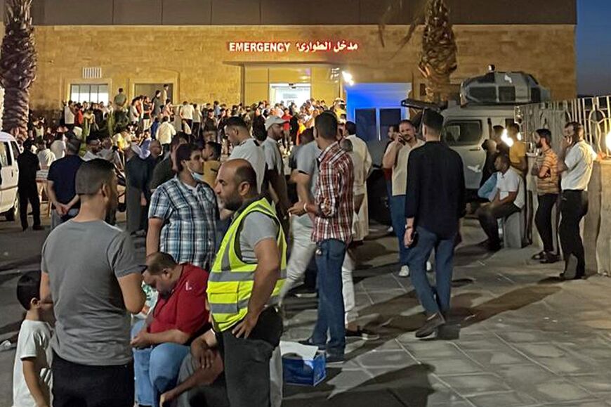 People gather outside a hospital in Aqaba, Jordan, after the gas leak injured more than 250 