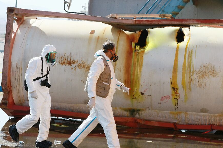 Yellow stains mark the side of the pressurised tank where it was punctured when it fell from a dockside crane leaking toxic chlorine gas in the Jordanian port of Aqaba