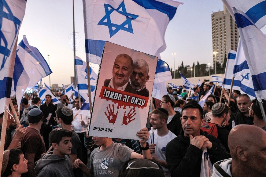 A right-wing protest in Jerusalem on April 6, 2022, with signs depicting Raam party leader Mansour Abbas besides an image of the leader of the Islamic movement Hamas, Yahya Sinwar