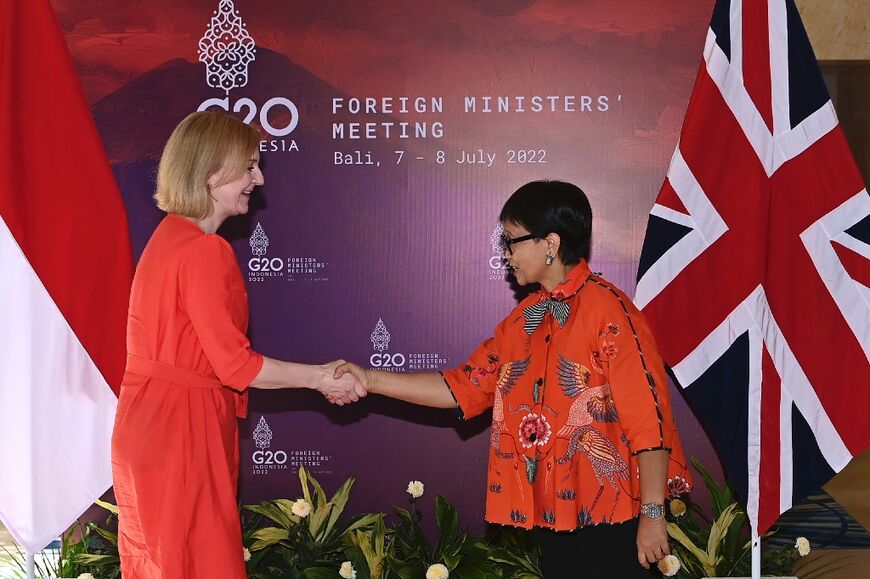 Indonesia's Foreign Minister Retno Marsudi shakes hand with Britain's Foreign Secretary Liz Truss during bilateral meeting for G20 Foreign Ministers Meeting in Bali