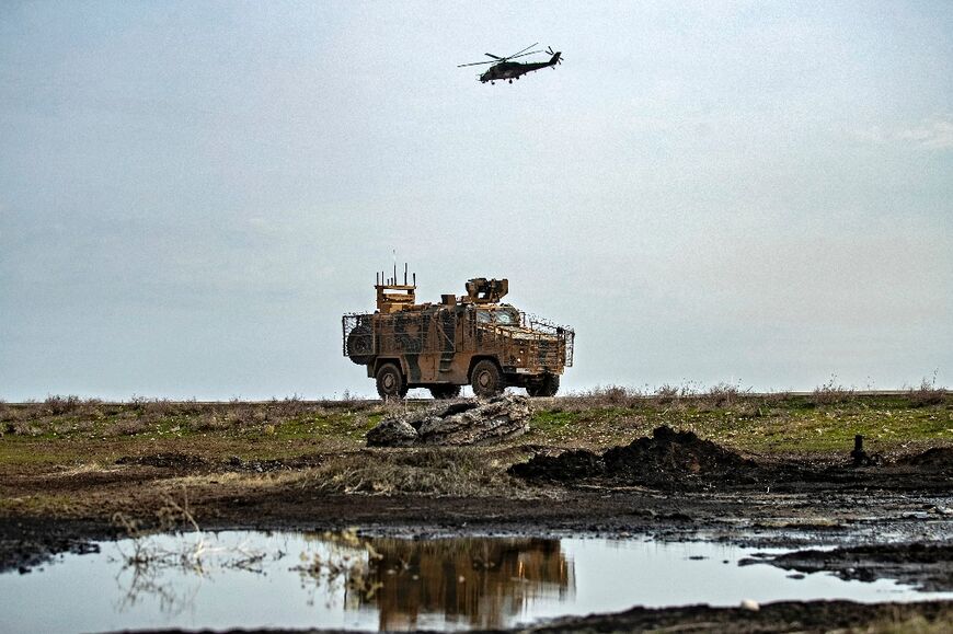 A Russian Mil Mi-24 Hind helicopter gunship escorts a joint patrol with Turkish troops last year of an area of northeastern Syria close to the Turkish border