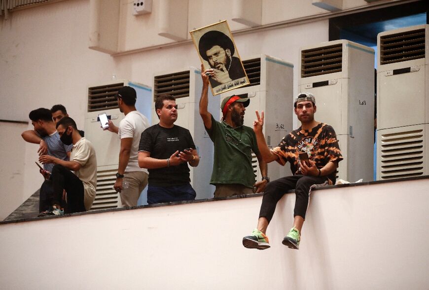 Sadr supporters took vantage points and sat in lawmakers' chairs before leaving parliament peacefully