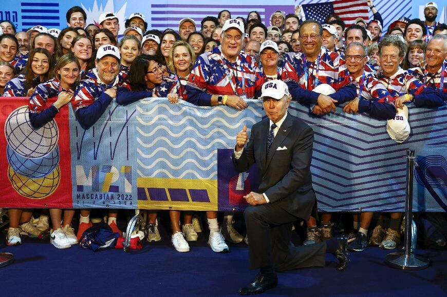 Biden took time during his gruelling Middle East tour to pose for a picture with US athletes competing in the Maccabiah Games at Teddy Stadium in Jerusalem 