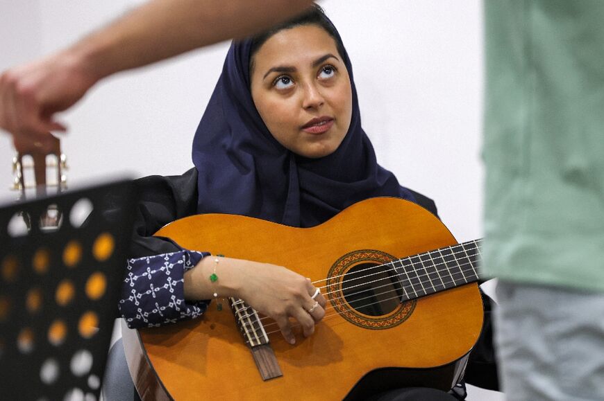 Wejdan Hajji, 28, says guitar classes at the Yamaha Music Centre in Saudia Arabia's capital Riyadh have helped clear her mind 