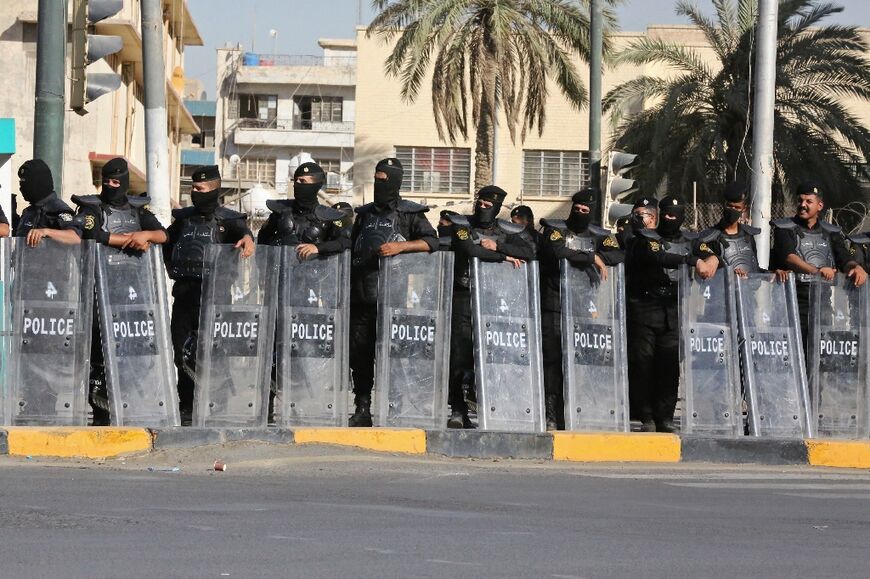 Iraqi security forces deploy as supporters of Muqtada al-Sadr gather in Baghdad's Tahrir Square on July 27