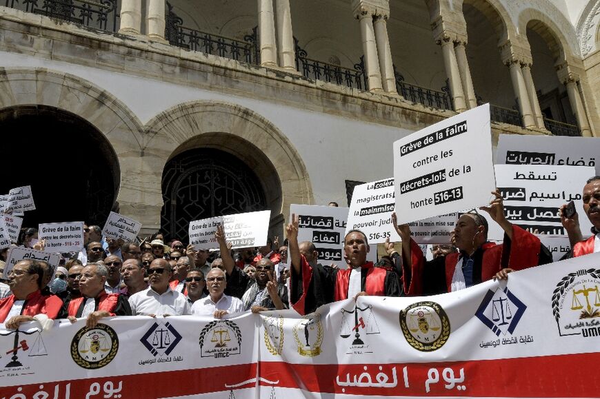 Judges gather for a protest against Tunisia's President Kais Saied outside the Tunis Palace of Justice in Tunisia's capital on June 23