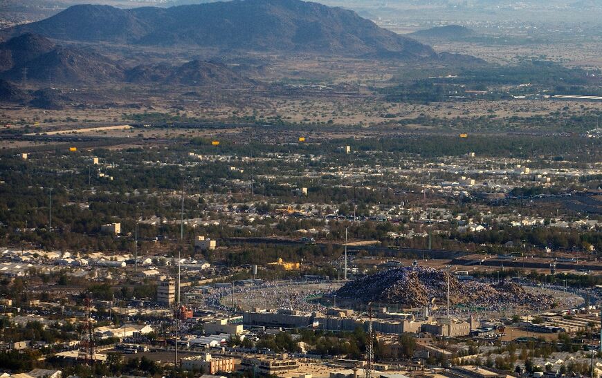 An aerial view shows Muslim pilgrims gathering atop Mount Arafat