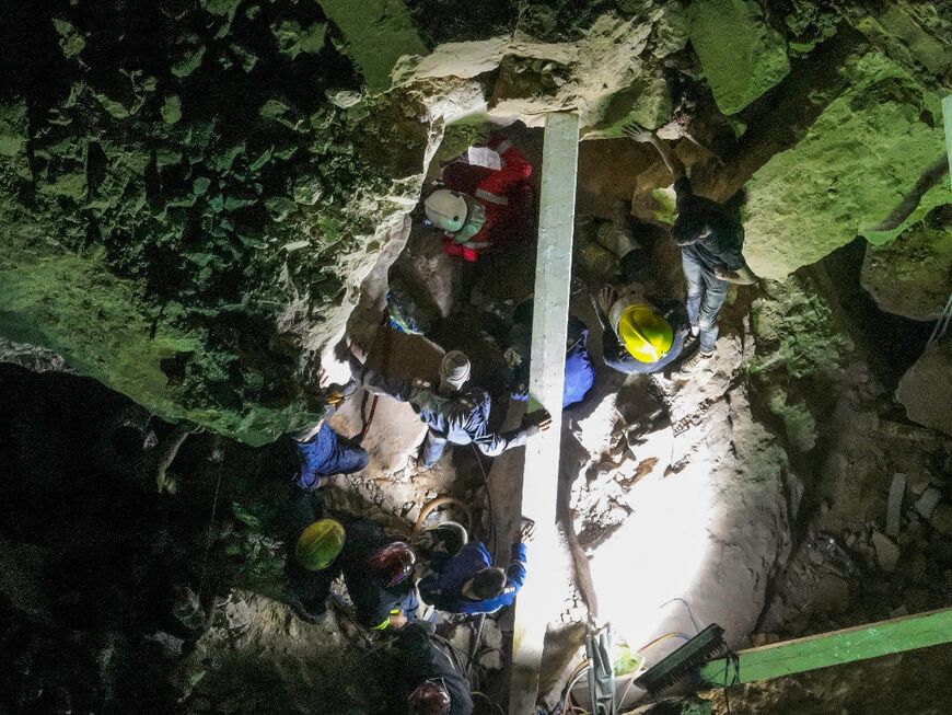 Iraqi rescue workers were battling to free at least six pilgrims trapped under the rubble