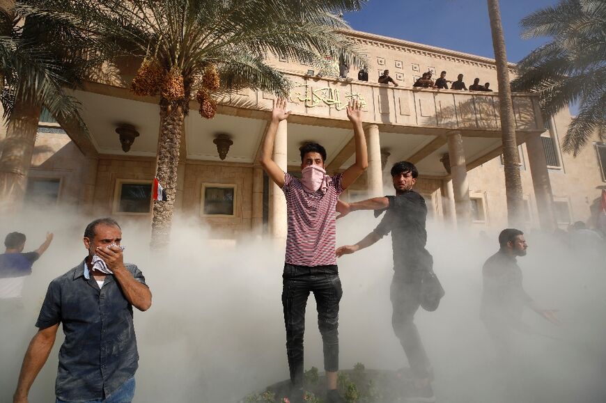 Crowds loyal to Moqtad Sadr marched on the government headquarters of the Republican Palace after the Shiite cleric said he was quitting politics