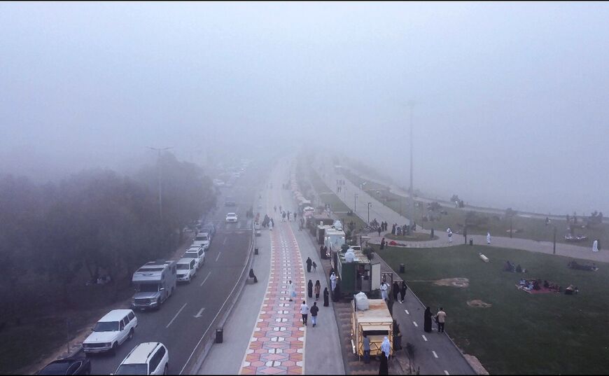 Tourist authorities have built a "fog road" for hikers and cyclists traversing a high summit that overlooks the mist-shrouded mountains