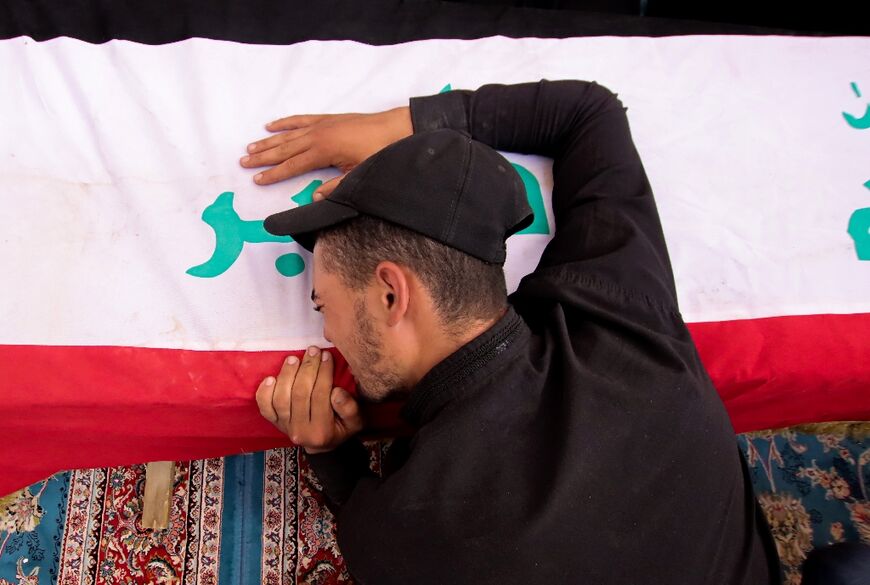 An Iraqi mourner attends a mass funeral for supporters of Shiite leader Moqtada Sadr who were killed during clashes in Baghdad's Green Zone