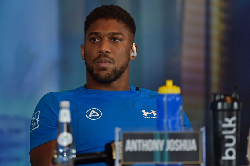 British boxer Anthony Joshua attends a press conference ahead of the heavyweight boxing rematch for the WBA, WBO, IBO and IBF titles in Jeddah