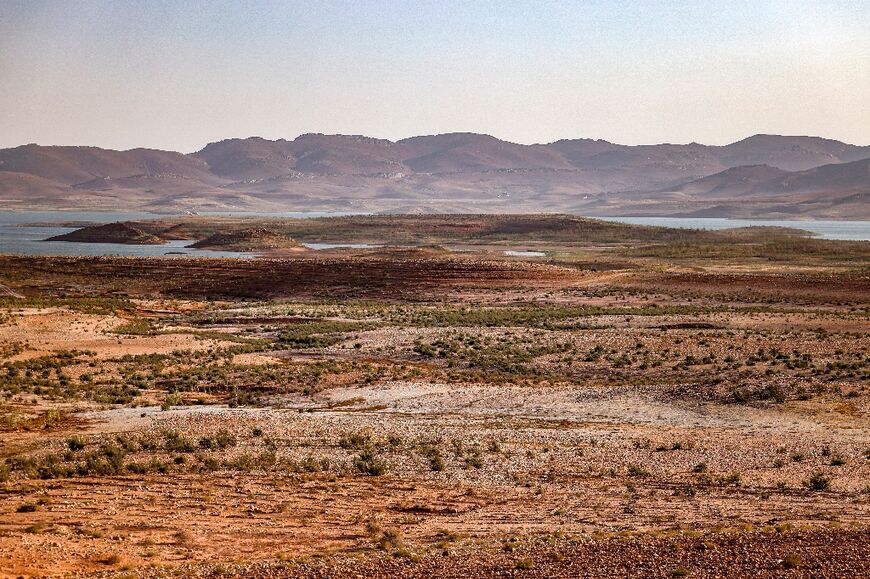 Dry landscape circles Al Massira Dam, Morocco's second largest