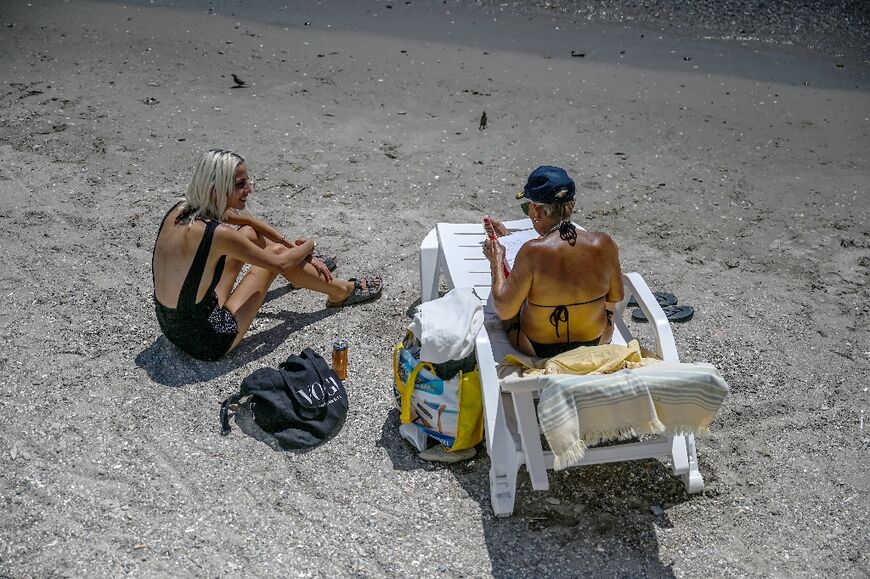 Some Istanbulites take their work to the beach and rush back if they get a business call