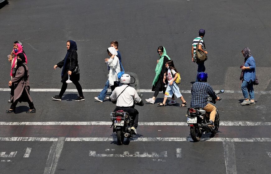 Iranian citizens seen in the capital Tehran on September 21, 2022