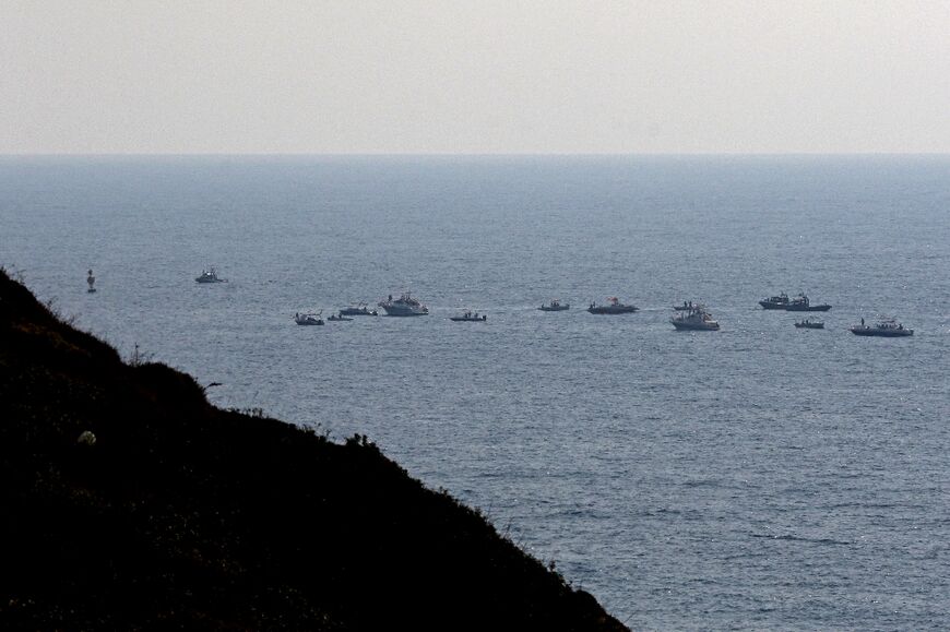 The maritime border dispute between Lebanon and Israel has prompted protests: here Lebanese protesters sail in boats with slogans affirming Lebanon's right to its offshore gas wealth on September 4