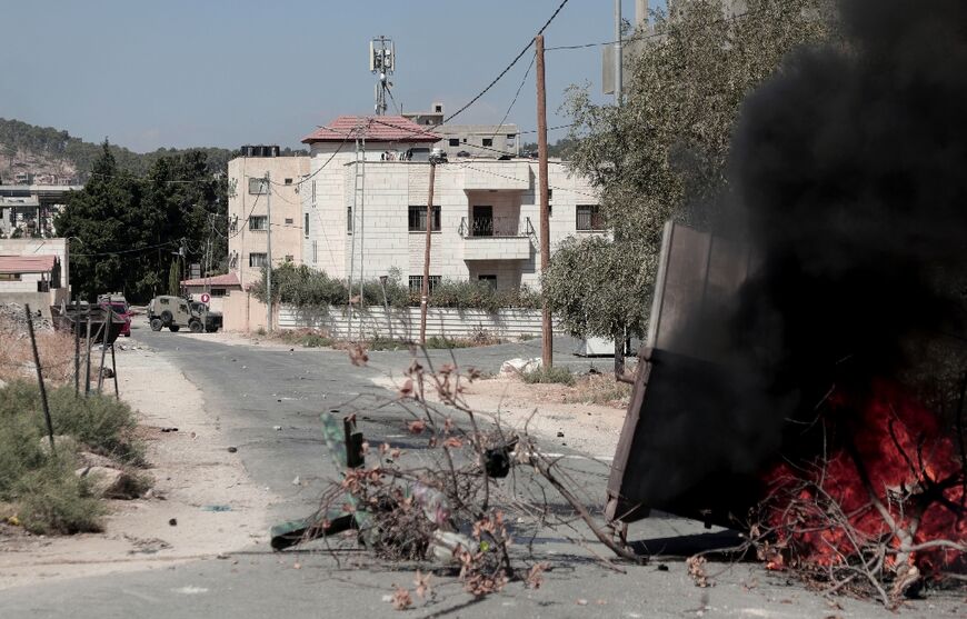 A makeshift road block is thrown up to block the path of military vehicles during an Israeli raid in the Palestinian militant hotbed of Jenin in the occupied West Bank