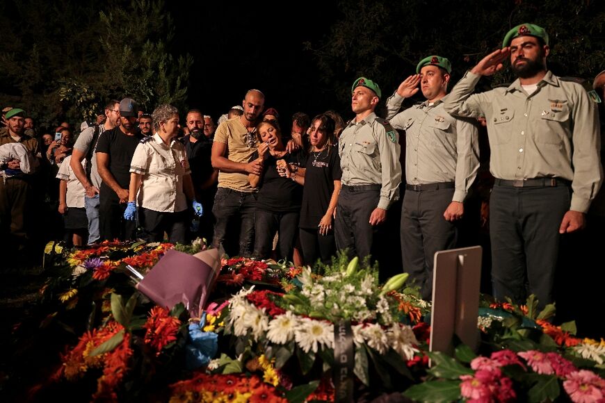 Israeli soldiers join family and friends at the funeral of Major Bar Falah, killed in clashes with Palestinians in the West Bank on Wednesday