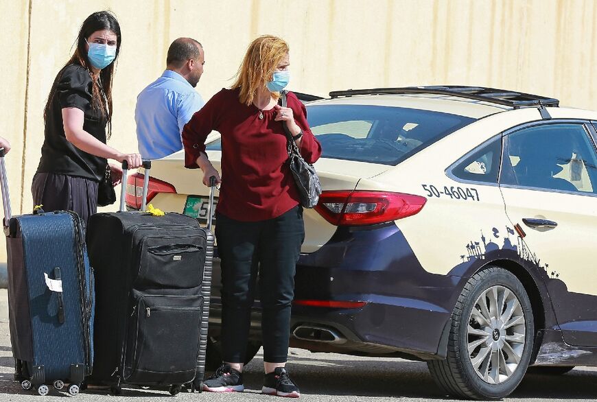 Passengers on the Jordanian side of the Allenby Bridge crossing between the West Bank and Jordan