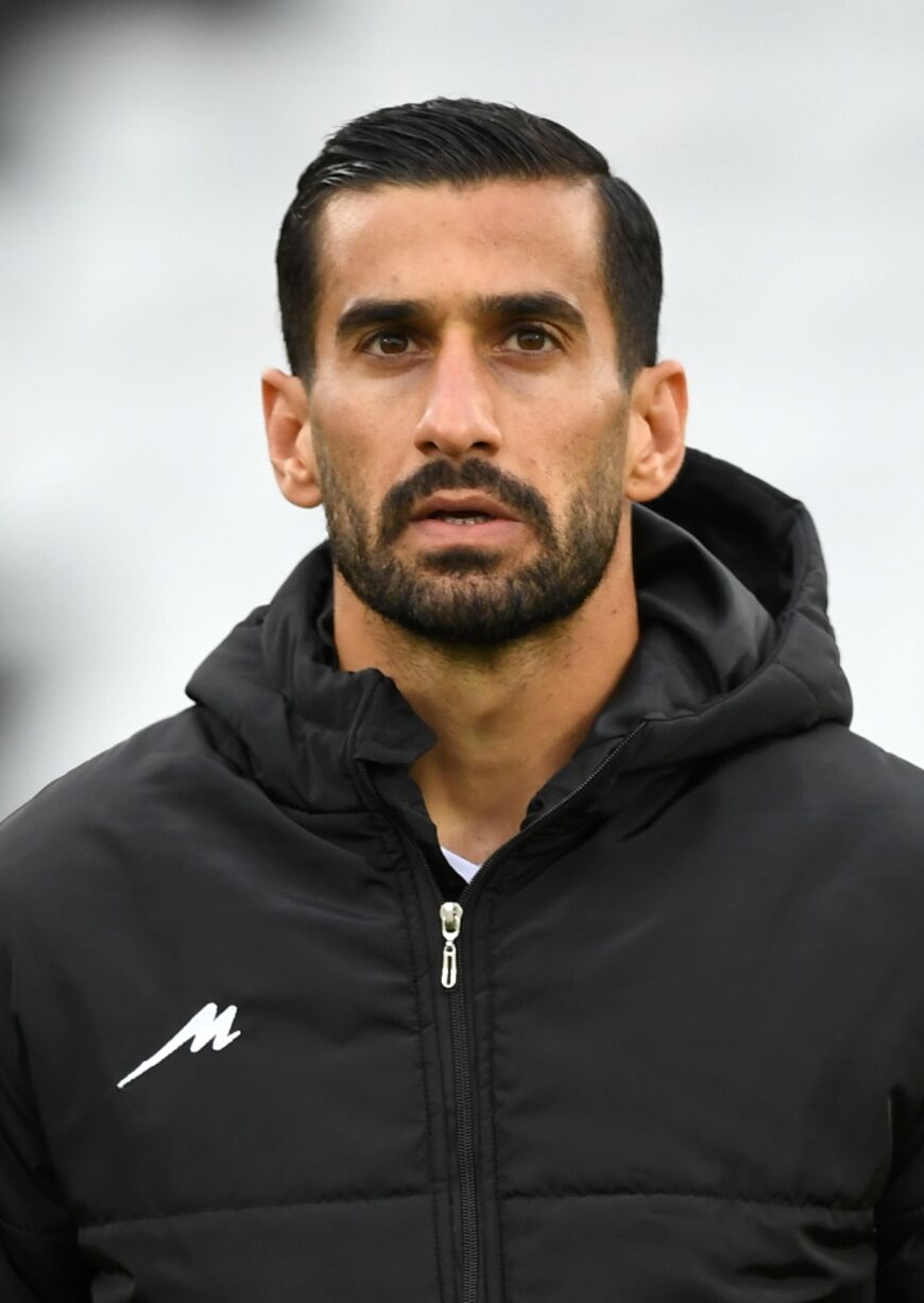 Iran players, including captain Ehsan Hajsafi, kept their tops on as the national anthem played