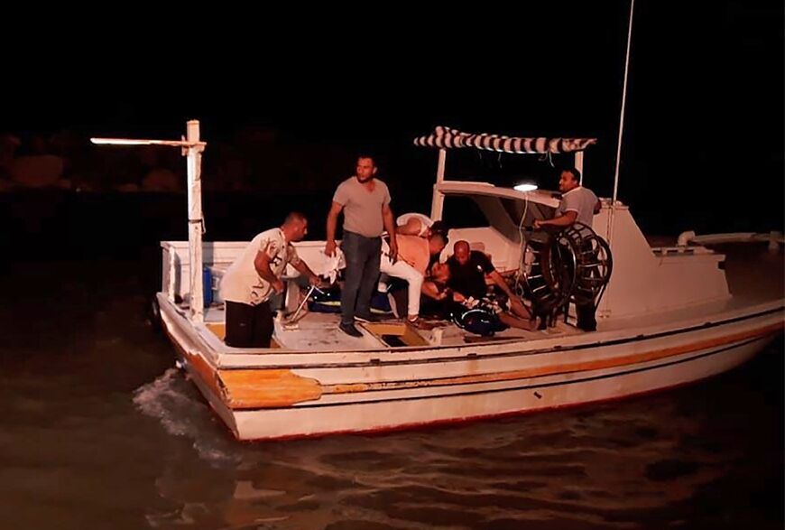 Rescuers search for survivors of the shipwreck off the coast of Syria's southern port city of Tartus