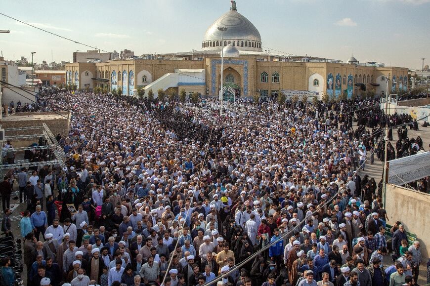 Iranians rally in Qom on October 28 to denounce a mass shooting by the Islamic State group at a shrine that killed more than a dozen worshippers