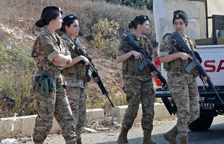 Lebanese Army soldiers are stationed along the main road near Lebanon's southern town of Naqura close to the border with Israel on October 27, 2022