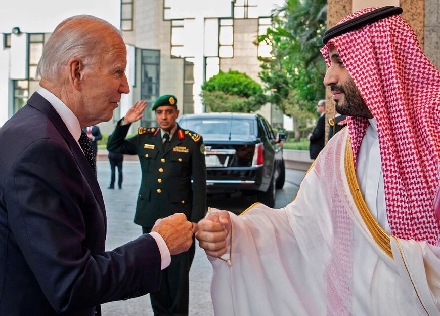 Saudi Crown Prince Mohammed bin Salman bumps fists with US President Joe Biden at Al-Salam Palace in the Red Sea port of Jeddah on July 15, 2022