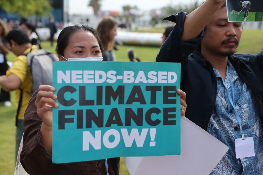 Climate activists protest outside the COP27 conference on November 17, 2022