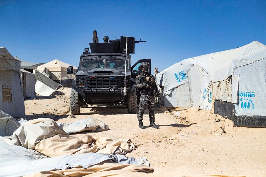 Members of the Syrian Kurdish Asayish security forces inspect tents at Al-Hol : the camp is overpopulated with more than 50,000 residents including relatives of suspected jihadists, displaced Syrians, and Iraqi refugees