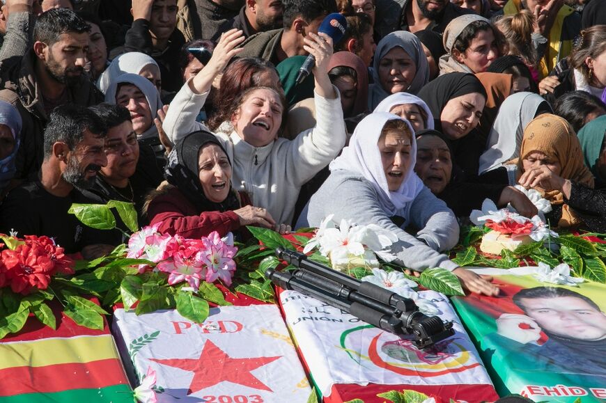 Thousands of people gathered to bury 11 people who died in Al-Malikiyah in Syria's far northeast