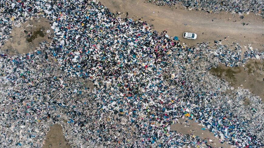 Aerial view of used clothes discarded in the Atacama desert, in Chile, on September 26, 2021 